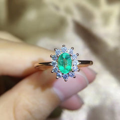 Emerald Oval Cut Engagement Ring in Sterling Silver with Halo Design