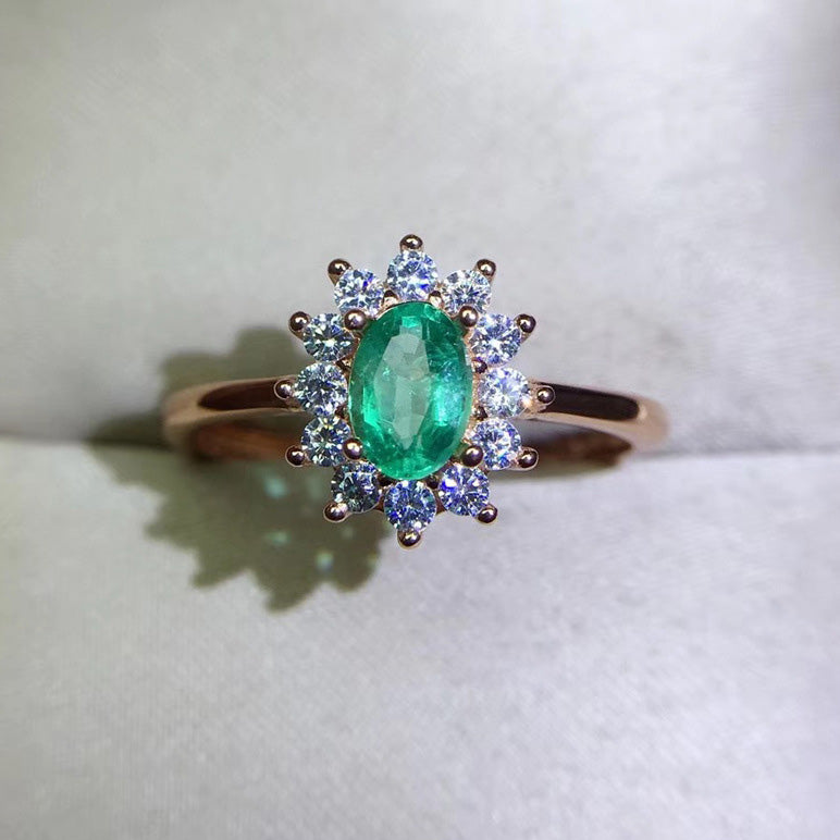 Emerald Oval Cut Engagement Ring in Sterling Silver with Halo Design