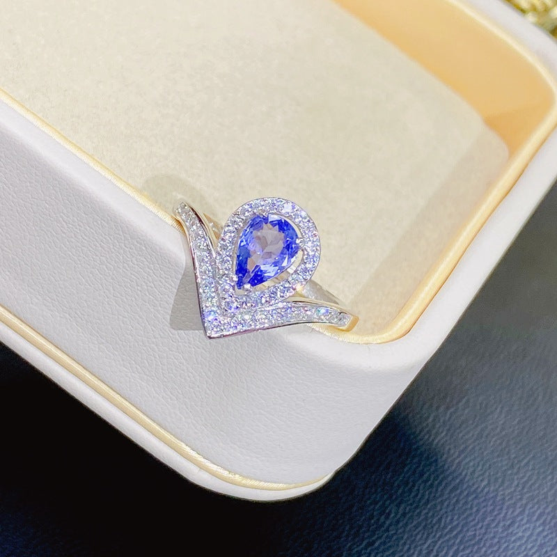 Tanzanite Pear-Shaped Engagement Ring with Accents and Halo Design in Sterling Silver