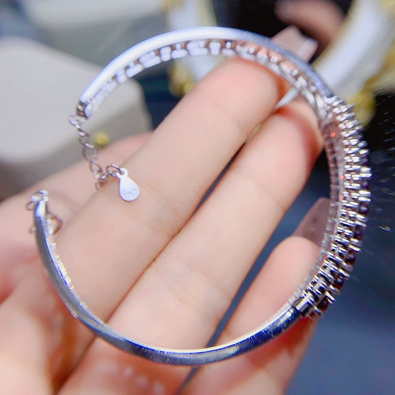 Garnet Oval Cut Bangle in Sterling Silver with White Gold Plating