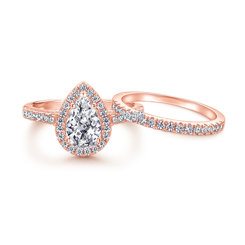 1.5-Carat Pear Cut Simulated Colorless Diamond Wedding Set in White Gold & Rose Gold-Plated Sterling Silver with Halo Design