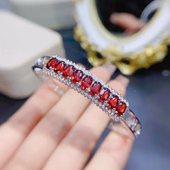 Garnet Oval Cut Bangle in Sterling Silver with White Gold Plating