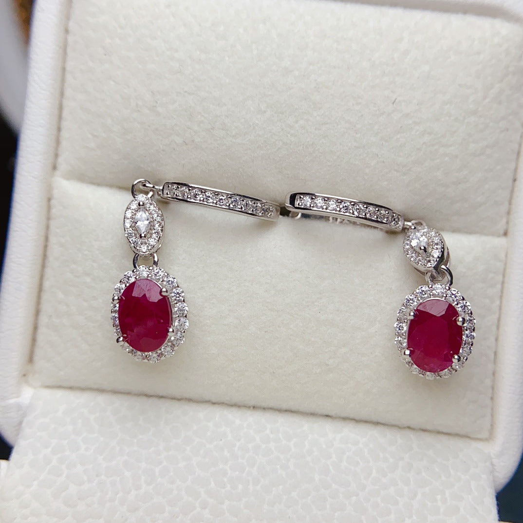 Ruby Oval Cut Drop Earrings in Sterling Silver with Halo Design