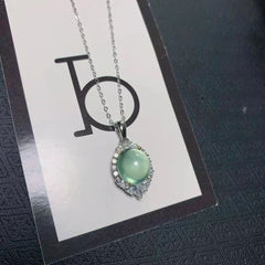 Tsavorite Oval Cut Necklace in Sterling Silver with Halo Design