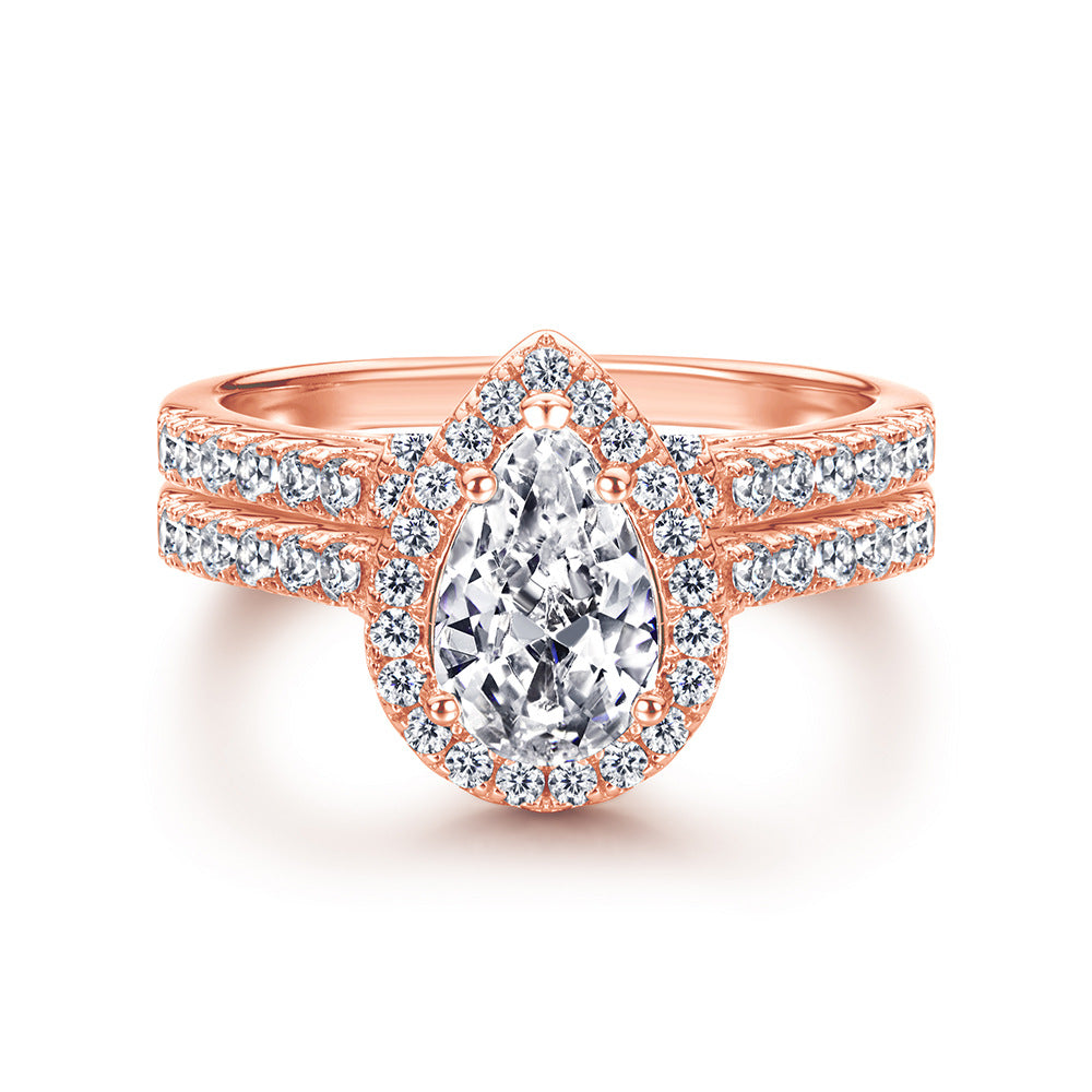 1.5-Carat Pear Cut Simulated Colorless Diamond Wedding Set in White Gold & Rose Gold-Plated Sterling Silver with Halo Design