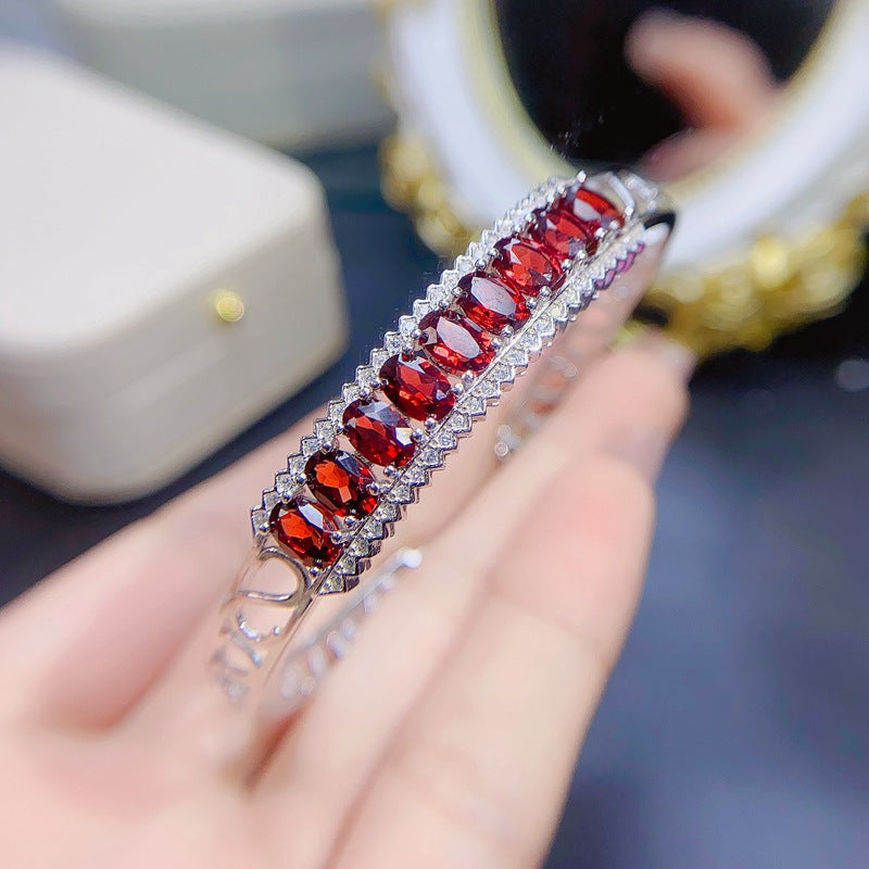 Garnet Oval Cut Bangle in Sterling Silver with White Gold Plating