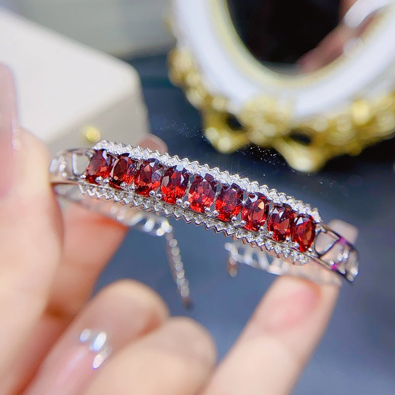 Garnet Oval Cut Bangle in Sterling Silver with White Gold Plating