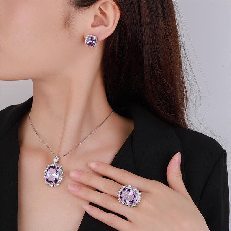 Simulated Radiant-Cut Purple Diamond Jewelry Set in White Gold-Plated Copper with Halo Design