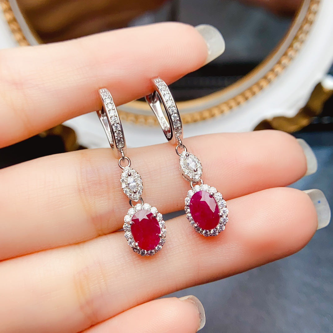 Ruby Oval Cut Drop Earrings in Sterling Silver with Halo Design