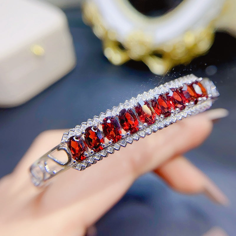 Garnet Oval Cut Bangle in Sterling Silver with White Gold Plating