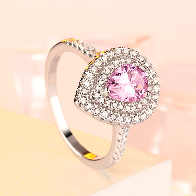 1.2-Carat Pear Cut Simulated Colorless and Pink Diamond Engagement Ring with Accents and Halo Detail