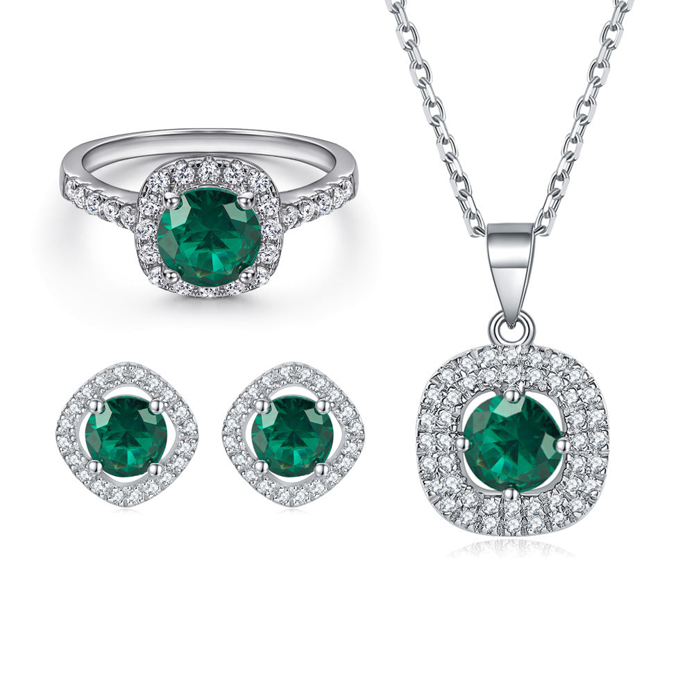 Elegant 3-Piece Sterling Silver Jewelry Set with Round Simulated Diamonds and Halo Design-Emerald