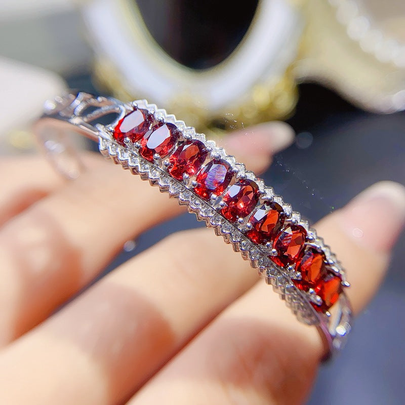 Garnet Oval Cut Bangle in Sterling Silver with White Gold Plating